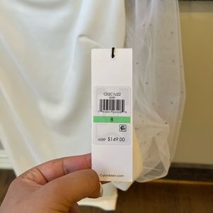 Calvin Klein white dress with rhinestones on sleeve. Size 8. Never worn